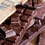 chocolate squares near a cutting board