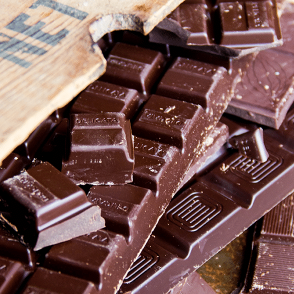 chocolate squares near a cutting board
