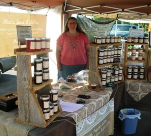 Monica in her booth with jam