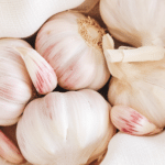 garlic bulks in a white dish towel