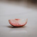 slice of white nectarine on a white counter