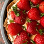 fresh strawberries on a vanilla crew pie