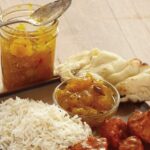 savory spiced mango chutney next to naan, rice and chicken
