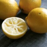 fresh Meyer lemons on a slate table