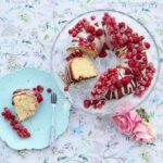 bundt cake covered in glaze and raspberry framboise rose jam