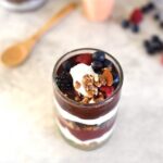 huckleberry jam on top of a yogurt parfait