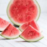 slices of watermelon on a white table