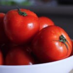 fresh tomatoes in a white bowl
