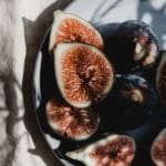fresh, sliced figs in a bowl in the sun light