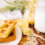 waffle topped with pineapple, lime + coconut jam surrounded by ingredients