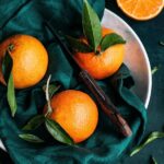 fresh oranges on a green napkin